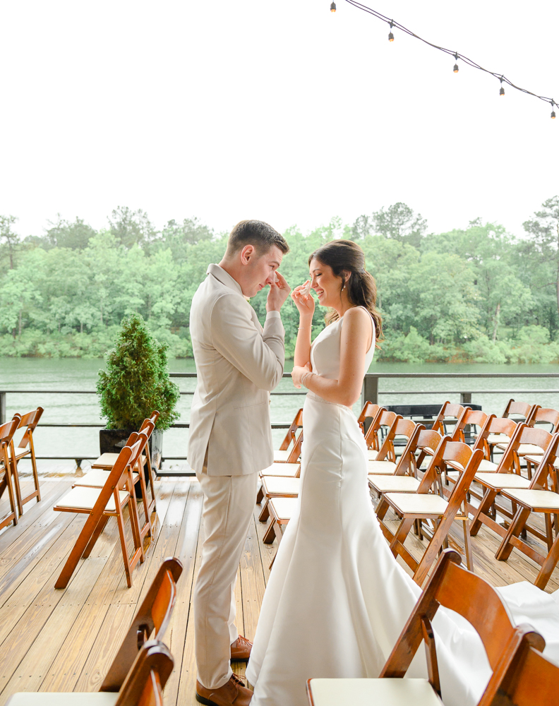 bride and groom crying together