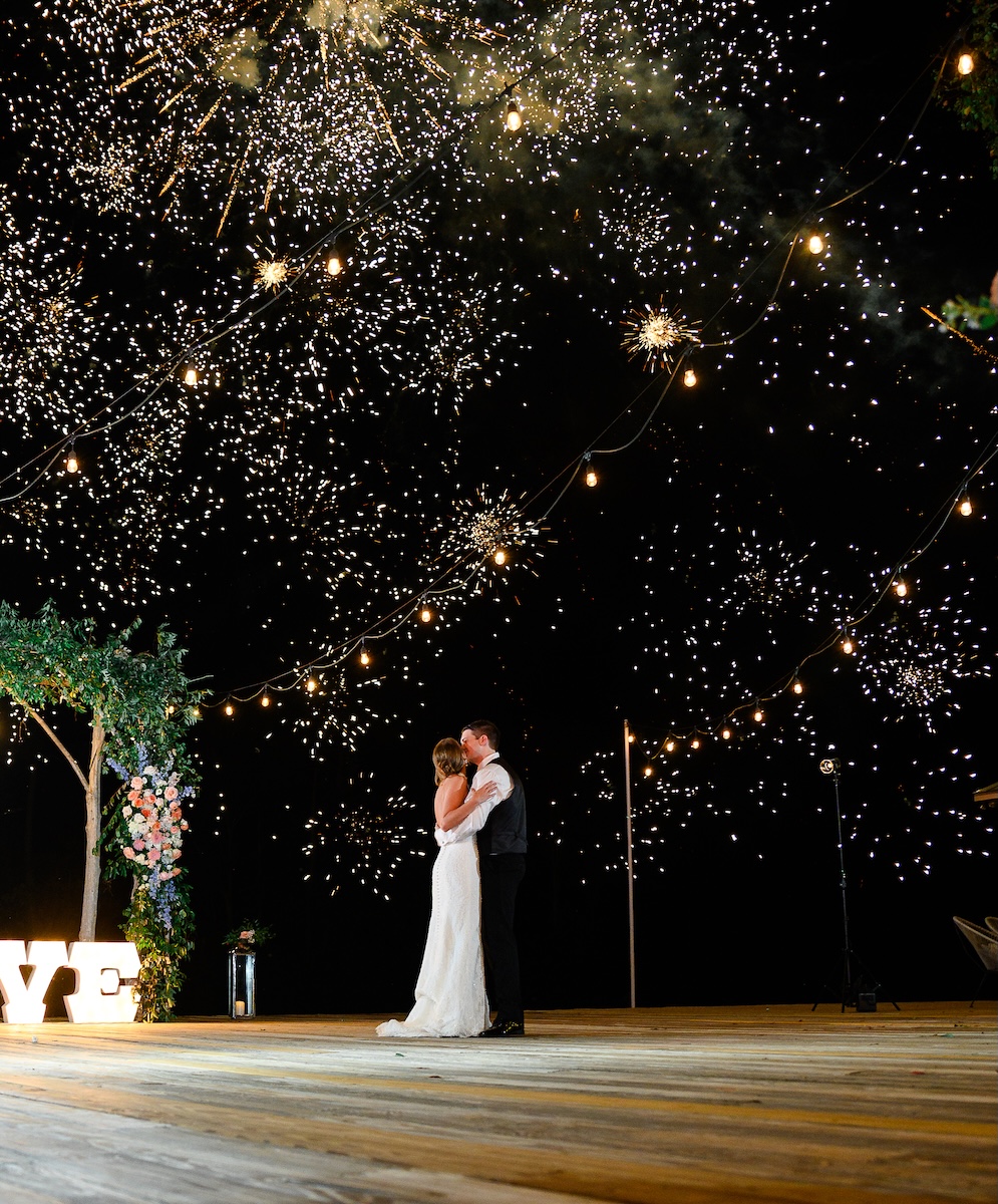 Bride and Groom enjoy the fireworks as they end their Wedding Reception at Serendipity in Dothan, Alabama